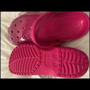 Crocs name brand pink and black with clear tops pink has tags never worn